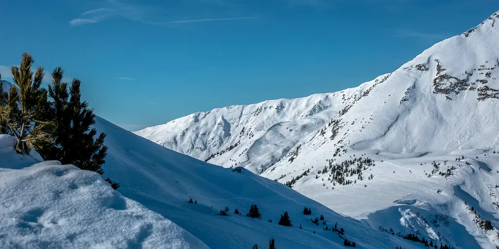 Snowy peaks and blue skies in La Clusaz